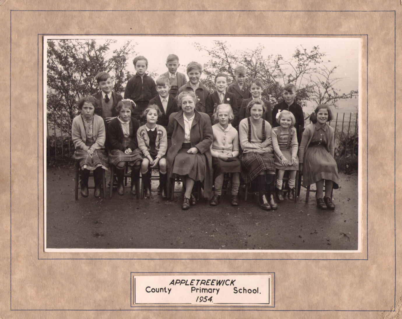 The headteacher and fifteen pupils